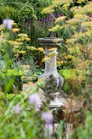 Capel Manor Gardens, London. Sundial in formal knot garden, parterre