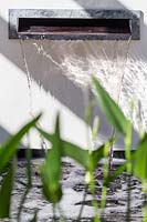 Hampton Court Flower Show 2014, the Al Fresco Garden, des. Peter Reader., water spout in contemporary garden