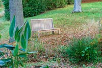 Perrycroft, Herefordshire. ( Archer ) bench in woodland garden,( PR available )