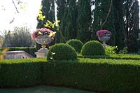 Villa La Foce, Tuscany, Italy. Large garden with topiary clipped Box hedging and views across the Tuscan countryside