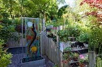 Carole Waller's garden at Bathford, Somerset, summer. Art installations in the garden by the artist Carole Waller