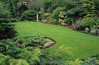 Private garden Wolverhampton Lawn gently sloping site colourful summer flowering annuals conifers