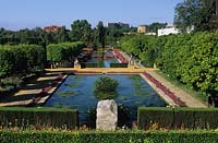 Jardines del Alcazar Cordoba Spain large public garden with formal pond and colourful flower beds