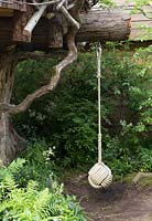 The RHS Back to Nature Garden  – rope swing for children hanging from tree branch, ferns - Designer: HRH The Duchess of Cambridge with Andree Davies and Adam White - Sponsor: The RHS 