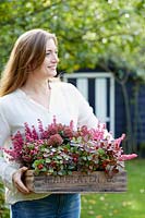 Young lady with autumn container