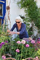 Woman adjusting climber support. 