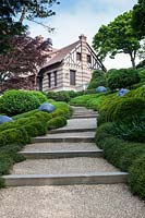 Muehlenbeckia complexa beside steps. Les Jardins D'etretat, Normandy, France