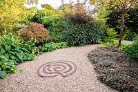 Mixed borders in the The Rust Garden, Dipley Mill, Hartley Wintney, Hants, UK. 