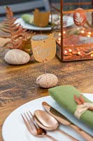 Easter place names made from chicken shaped cards fixed to pebble with copper wire