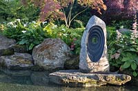 Large pond water feature in 'At One With A Meditation Garden' - Howle Hill Nursery, RHS Malvern Spring Festival, 2017.