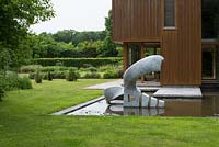 Marble sculpture: Bird by Jessica Walters with oak clad extension by James Gorst, Suffolk