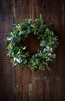 Christmas wreath made with pine, hypericum berries, Eucalyptus, Leptospermum and Ivy