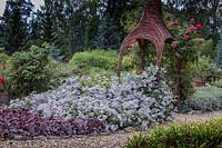 Vicker altana with blue Clematis x jouiniana 'Praecox'