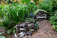 Wildlife garden with bug chalet - Pam Woodall's garden, 'Pinecombe' in Dorset, UK