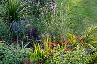 Mixed summer border. Pam Woodall's garden, 'Pinecombe' in Dorset, UK