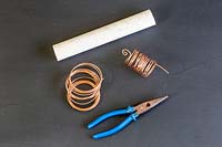Materials for making a copper wire coiled spring. 