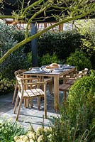 Dining area with wooden  table and chairs - The Landform Spring Garden - Ascot Spring Garden Show, 2018 