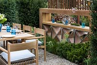 Dedon Tibbo dining table and chairs  - Outdoor dining area  with shelving partition - 'A Garden for all Seasons', Ascot Spring Garden Show, 2018 