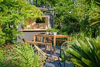 Metal shed with Dining Table,'B and Q Bursting Busy Lizzie' Garden, RHS Hampton Flower Show, 2018