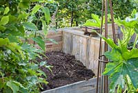 Wooden compost bins. 'RHS Grow Your Own with The Raymond Blanc Gardening School', RHS Hampton Flower Show, 2018 
