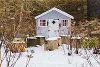 Wendy house with cubes as seats or tables. Yews Farm, Martock, Somerset, UK