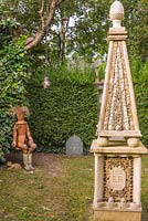 Obelisk built to commemorate the Queen's Golden Jubilee. The Secret Garden at Serles House, Dorset, UK.
