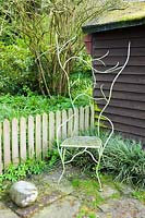 Metal seat by Dave Bissell. Moors Meadow Garden and Nursery, Bromyard, Herefordshire, UK