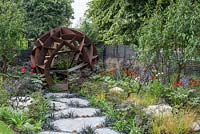 Corten steel sphere by William Roobrouck - Elements Mystique Garden, Sponsored by Elements Garden Design, RHS Hampton Court Palace Flower Show, 2018.