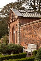 One of the classical Orangeries built into the brick wall in the Walled garden at Castle Bromwich Hall Gardens, UK. 