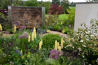 Lupins, Allium, Salvia 'Caradoona' and Viburnum maresii feature in the 
Cruse Bereavement Care: A Time for Everything Show Garden   