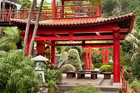 The double height Temple with gold buddha in the Southern Oriental garden in Monte Palace Tropical Garden