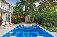 Swimming pool in tropical garden. The Jones Residence, Key West, Florida, USA. Garden design by Craig Reynolds.
