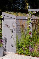 Small shed with living roof in 'Secured by Design' garden
