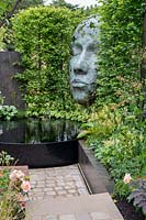 'The Thrive Reflective Mind' garden with raised pond, raised bed and sculpture
