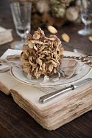Dried Hydrangea place setting on vintage book