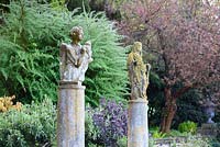 Italian carved stone figures on columns at Iford Manor, Bradford-on-Avon, Wiltshire, UK. 