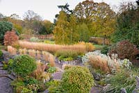 Aerial view of terraced garden with autumn colour at Barn House, Chepstow, UK.
