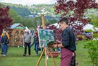 Artist Tom Genders, painting The Leaf Creative Garden by Peter Dowle, RHS Malvern Spring Festival 2019