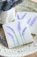 Decorative tiles made from salt dough and pressed and painted lavender flowers 