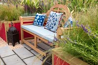 Colourful bench in Petrus' Paradise by Rachael Bennion with Petrus and volunteers RHS Tatton Flower Show 2019