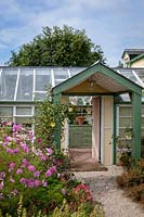 Garden Cottage at Gunwalloe in Cornwall.  Cottage garden in autumn. The conservatory.