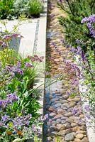 Pebblie filled water rill with soft planting - The Viking Cruises Lagom Garden, RHS Hampton Court Palace Flower Festival 2019