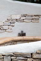 Detail of the curved seating area made from Purbeck stone. Garden: The Kingston Maurward Garden. Sponsors: Miles Brown, Kingston Maurward College, Goulds Garden Centre, Wilks Landscaping, Holme for Gardens, The Green Gardener. Chelsea Flower Show 2019.