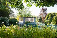 View to the balustrade and viewing point. Hydrangea arborescens Annabelle in foreground. Orekhovno garden, Orekhovno, Pskov Oblast region, Western Russia.