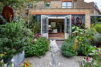 This area is known as the Parterre with herbaceous borders and views back to the house. The tall feathery plants are Foeniculum vulgare - green and purpureum - bronze with Helenium Wyndley, Echinacea Magnus Superior, Echinacea Pow Wow White, Canna Tropicana Black, Agastache Black Adder.