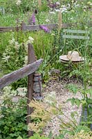 Perennials along rustic timber fence in The BBC Spring Watch Garden at RHS Hampton Court Festival - Design: Jo Thompson in consultation with Kate Bradbury