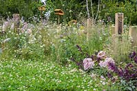 Bug hotels surrounded by flowering perennials - The BBC Spring Watch Garden - RHS Hampton Court Festival.