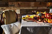 Table setting with rich colours from squashed and pumpkins