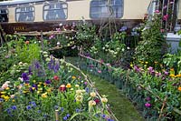 Vintage train and cut flower garden in the 'Made in Birmingham' garden at BBC Gardener's World Live 2018.