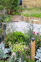 Planting in front of raised bed made of recycled wood - Believe in Tomorrow Garden - RHS Hampton Court  Palace Garden Festival 2019 